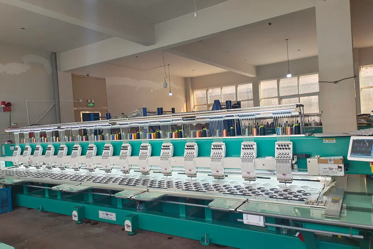 Embroidery machine stitching plush face panels for custom plush production