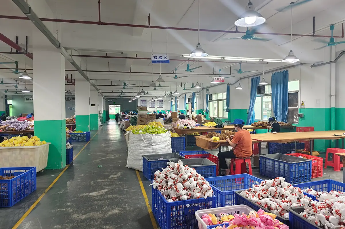Plush toy inspection and sorting workshop with finished toys in baskets