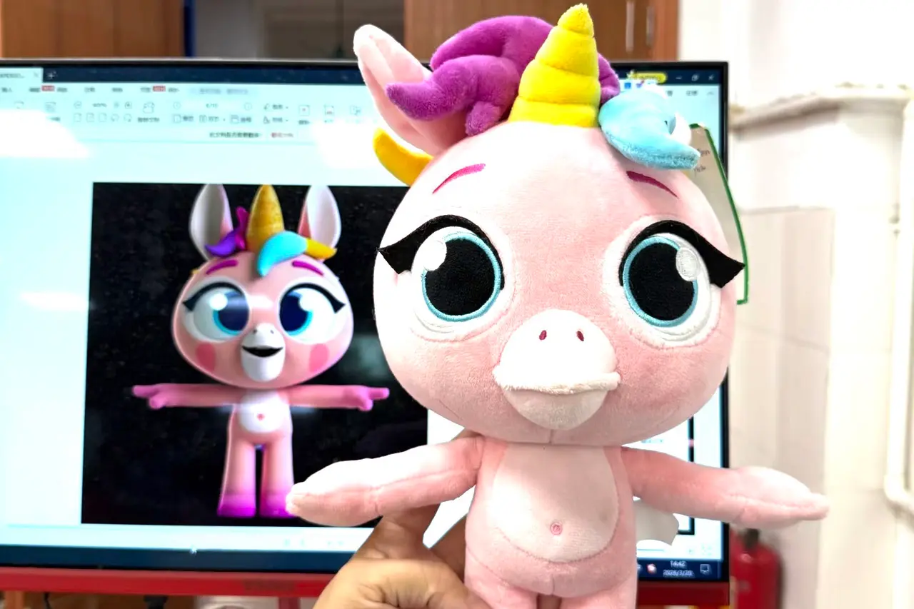 pink unicorn mascot plush sample beside digital character reference