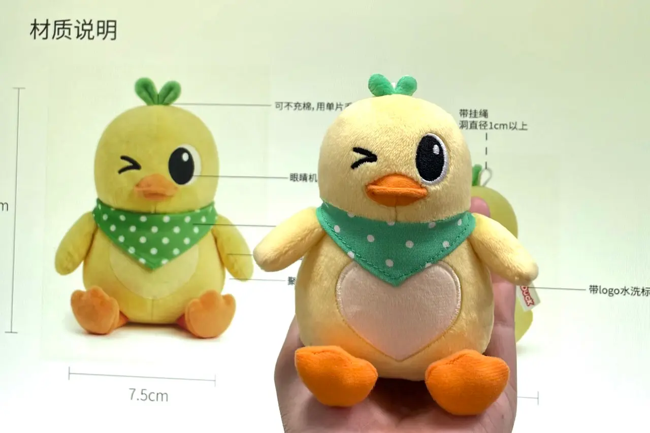 yellow chick plush keychain with green bandana and heart belly patch