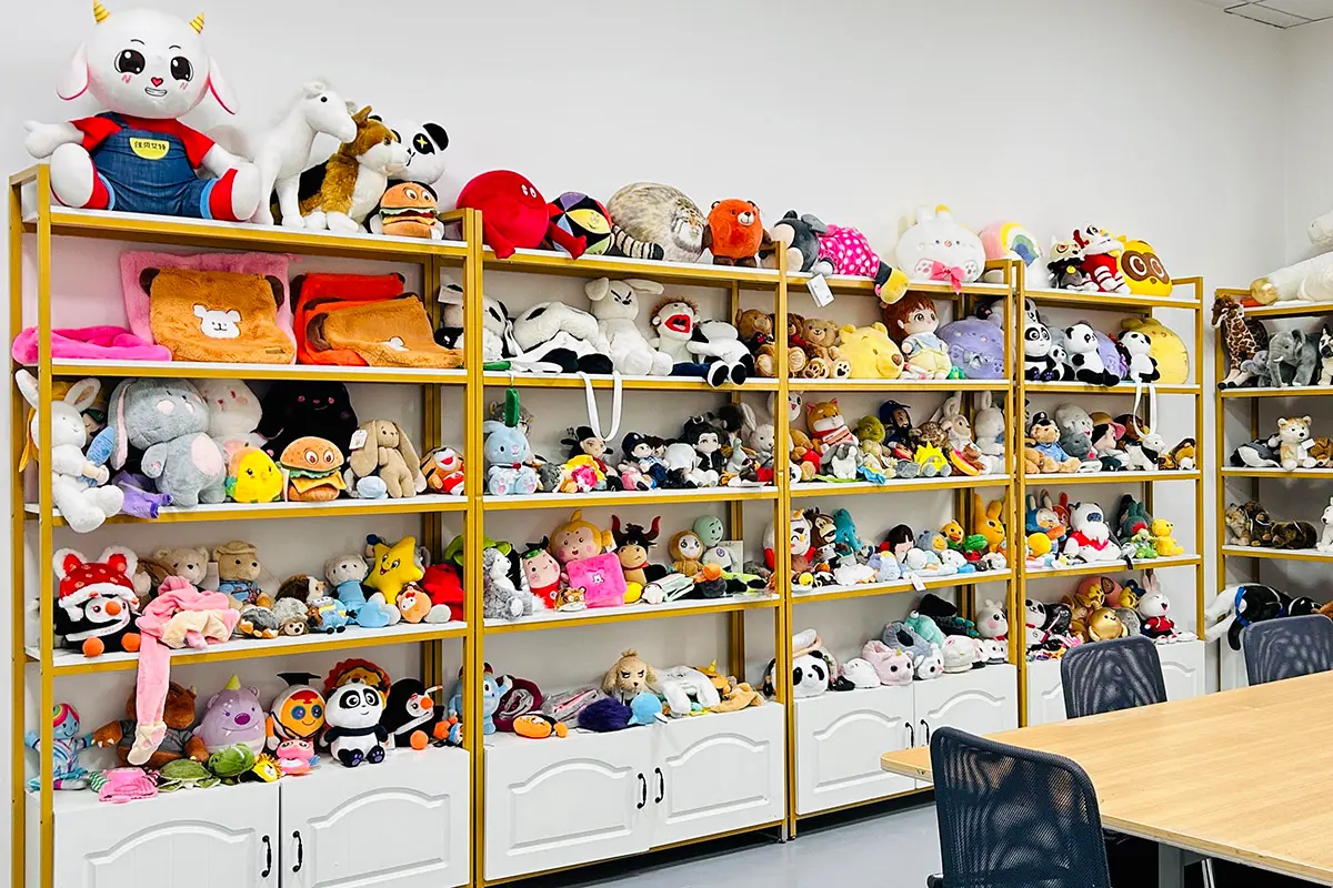 Sample room shelves with plush toys and custom plush bag samples