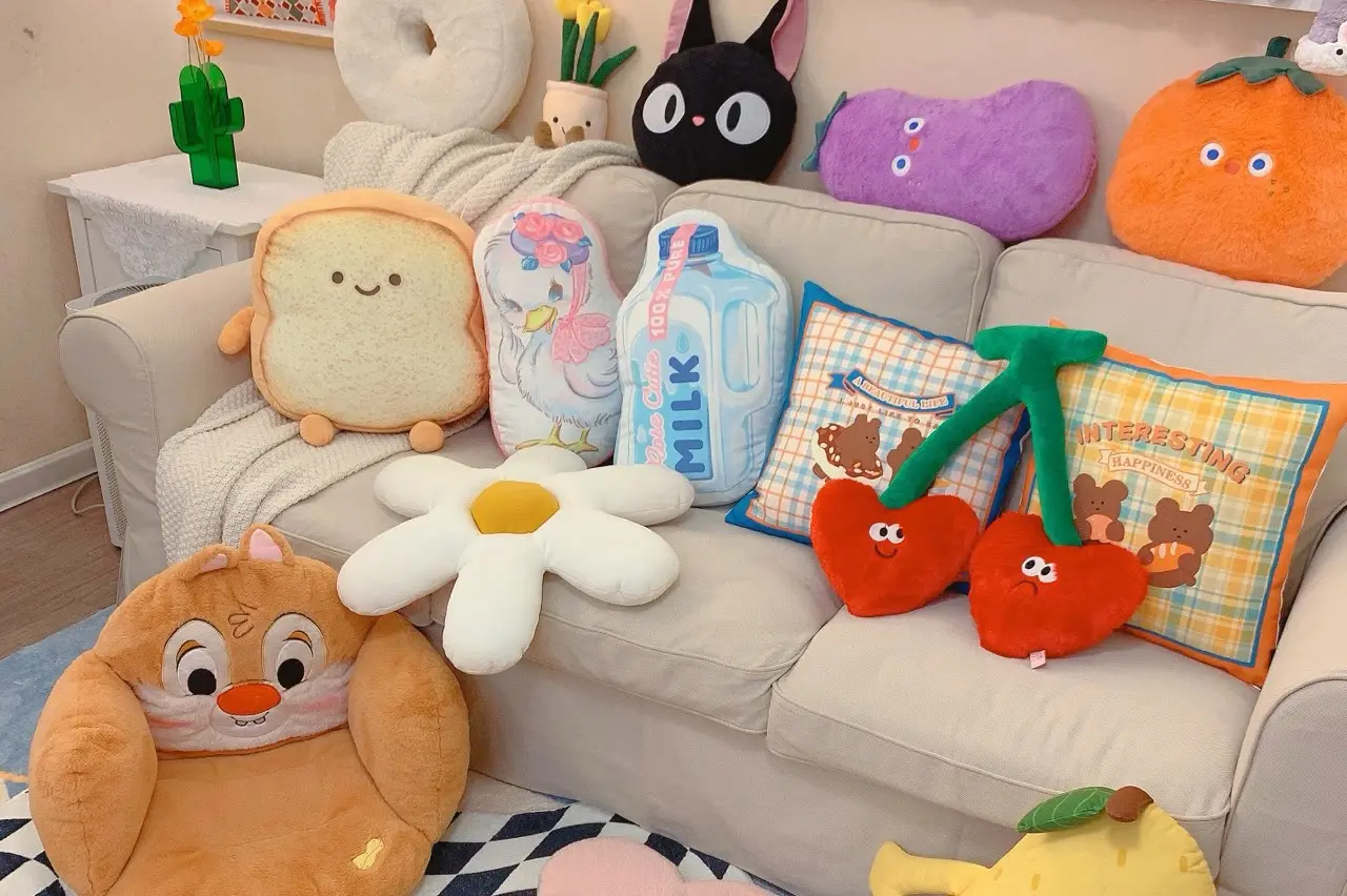 Sofa display with custom shaped plush pillows and character cushions