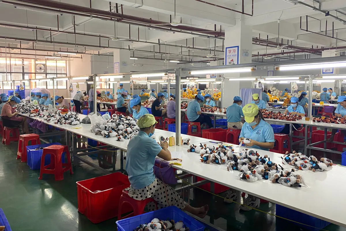 WisePlush factory workshop producing plush keychains on sewing and finishing lines