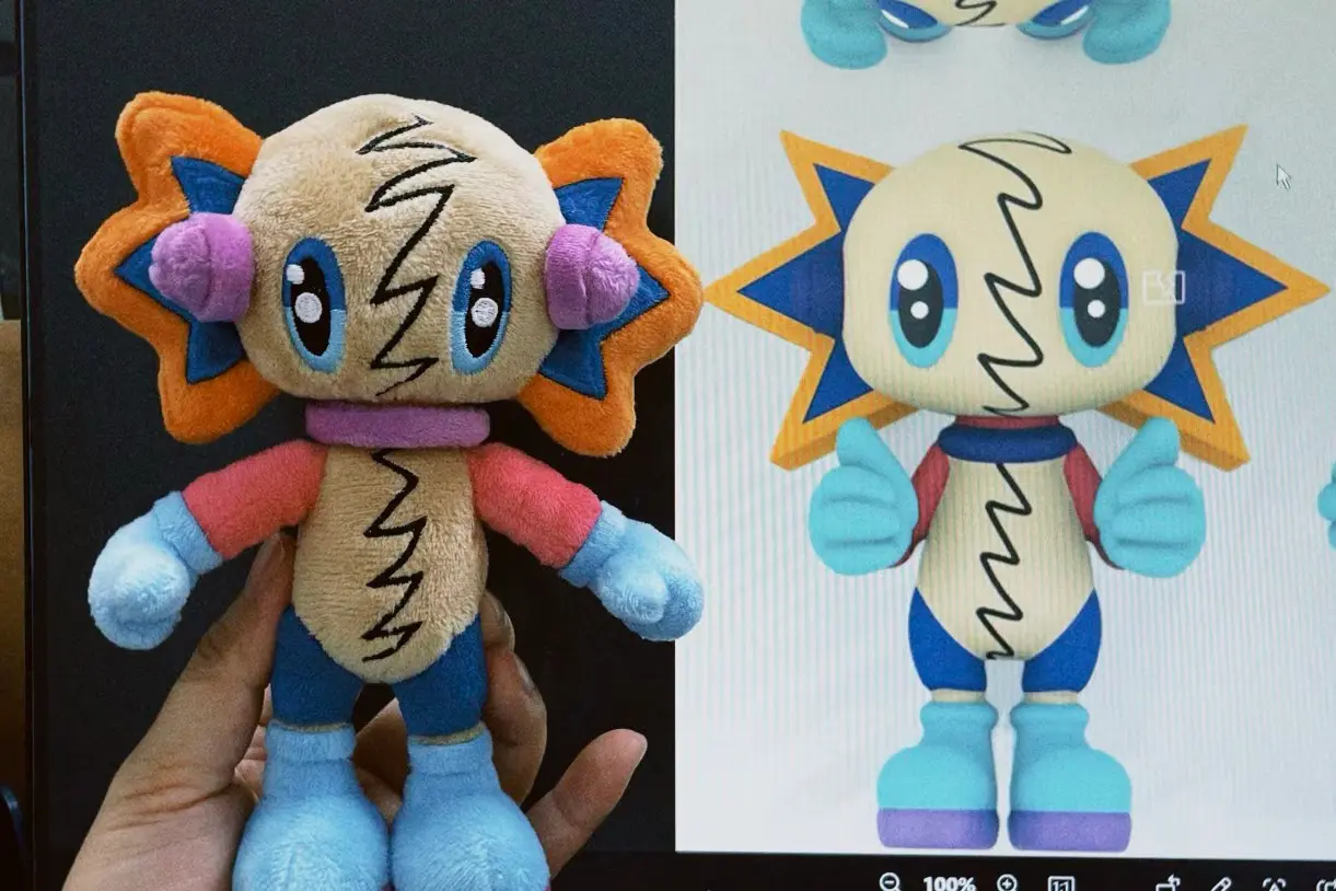 Colorful character plush sample held beside the matching digital design artwork