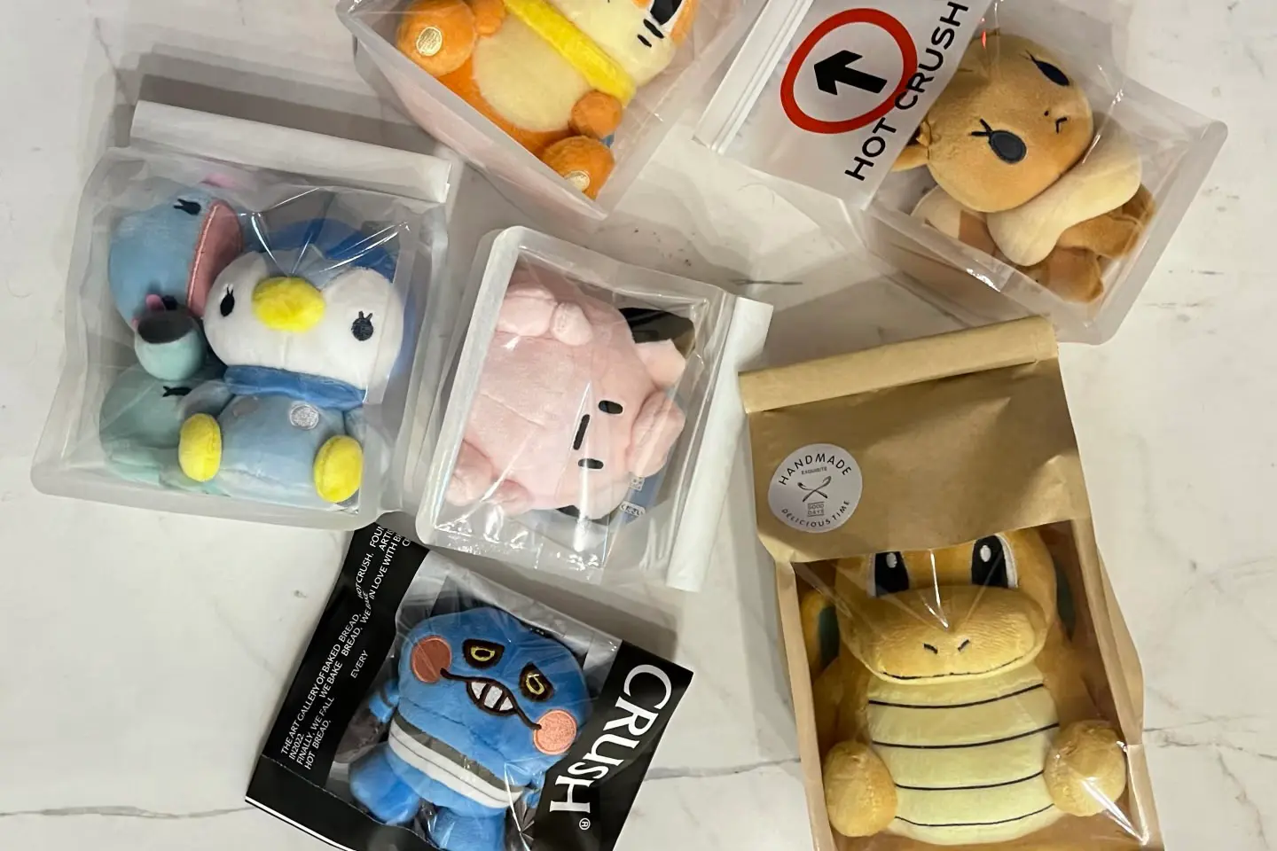 Character plush samples with retail boxes poly bag hang tags and fabric swatches