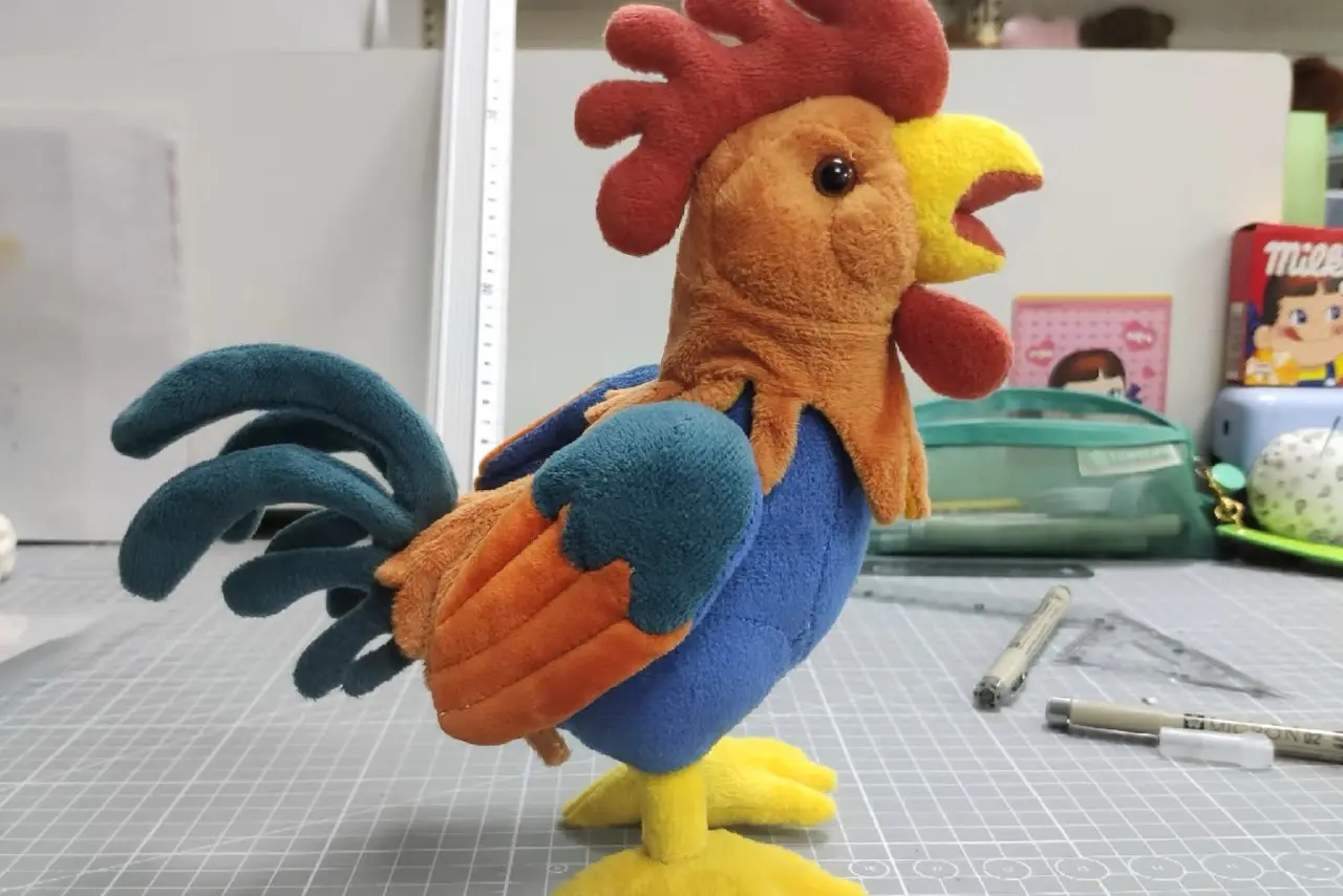 Rooster plush toy sample showing 3D shape, fabric colors, and filling structure